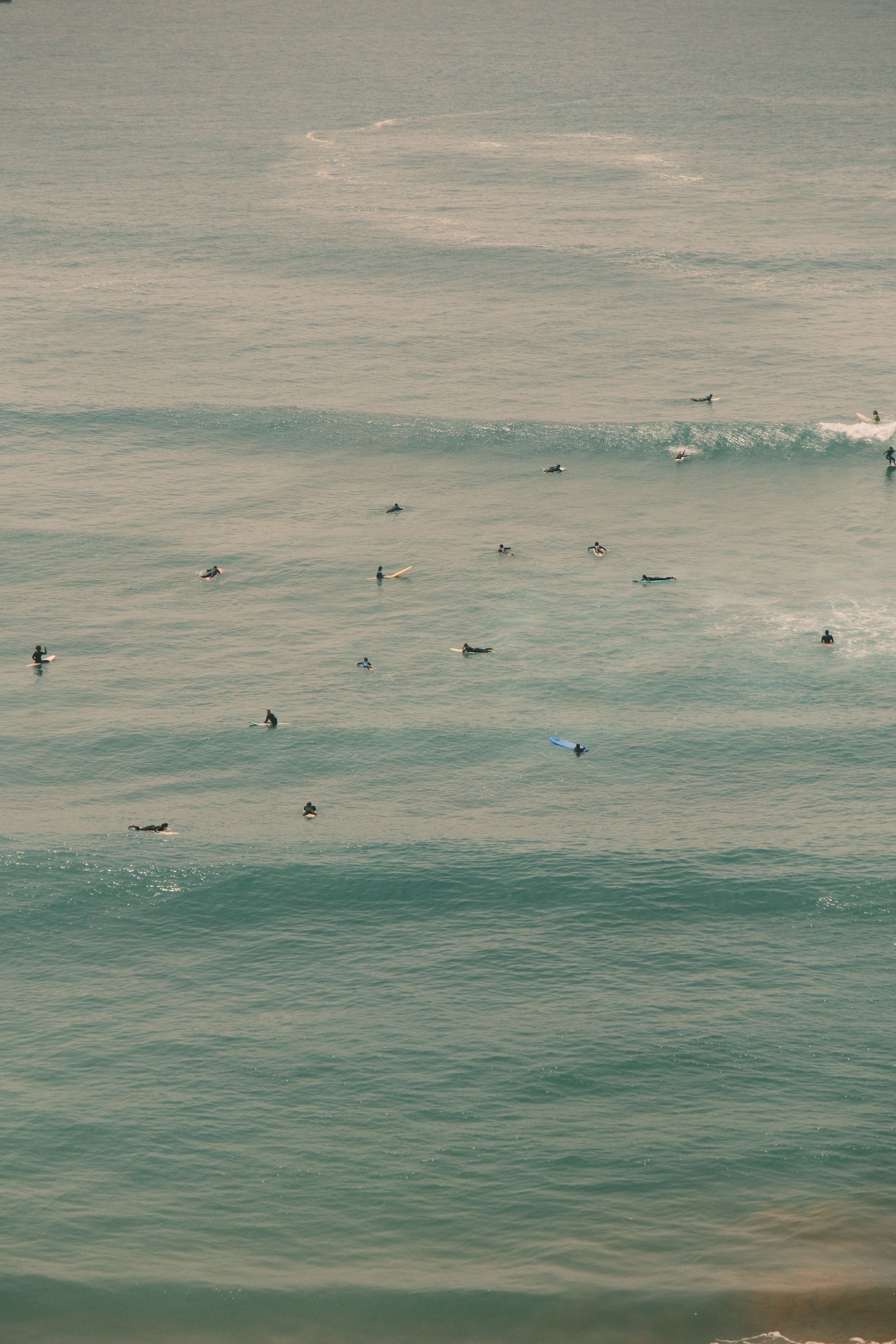 Surfers catching waves in the Atlantic off Morocco
