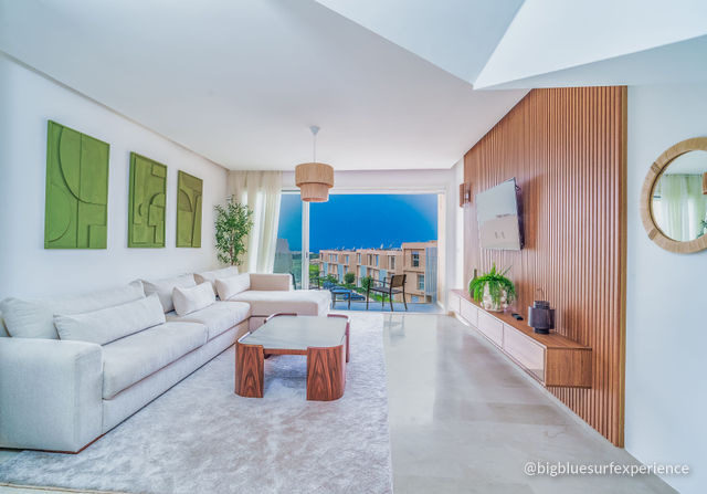 Living room of the BigBlue Bay Duplex opening onto the balcony