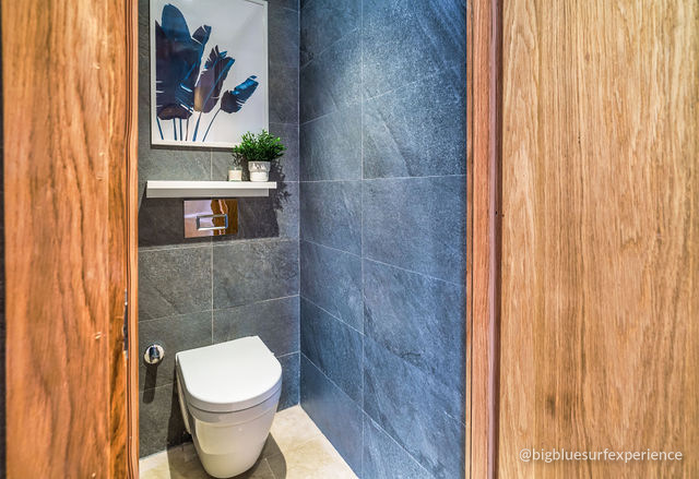 Separate WC downstairs in the BigBlue Bay Duplex, slate walls and a wooden door