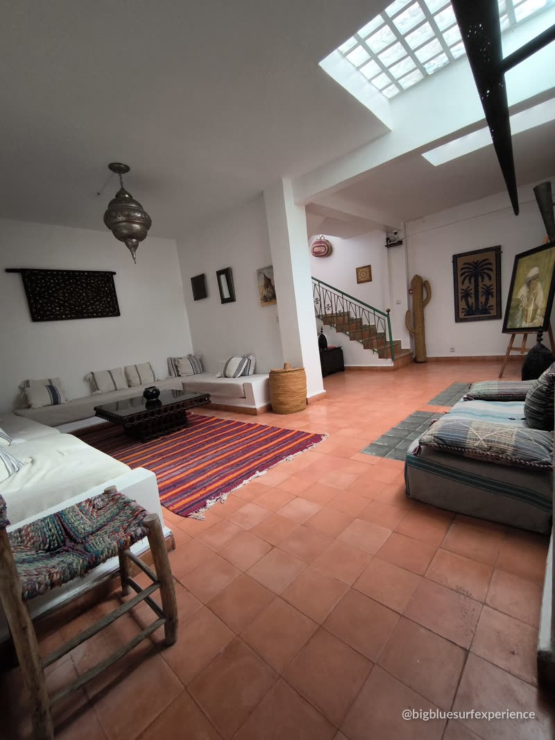 Open lounge with skylight, low seating and traditional decor