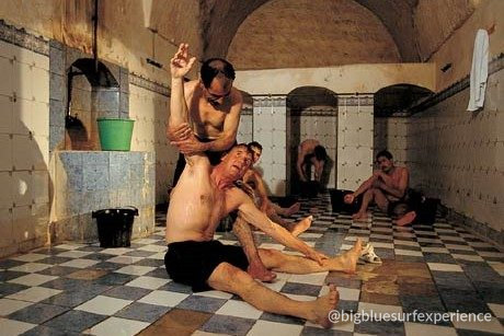 Traditional Moroccan hammam with tiled floor and gommage treatment